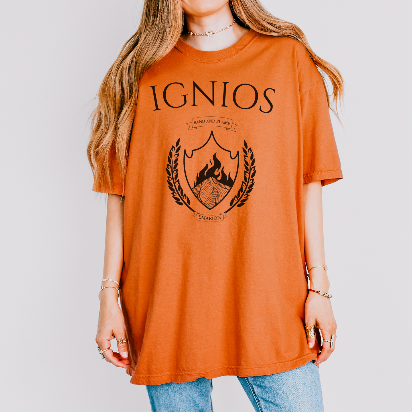girl wearing a shirt with 'IGNIOS' written on it