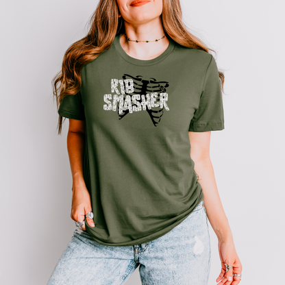 Person wearing a green t-shirt with 'Rib Smasher' graphic design on a plain background